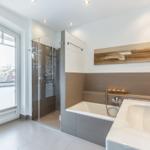 Bathroom with shower, bathtub, and window to terrace