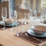 Table set with dishes and glasses for four people