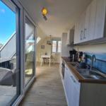 Kitchen with view of terrace and dining area