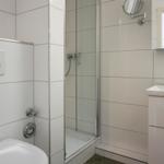 Bathroom with shower, sink and toilet