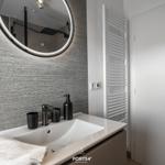 Bathroom with sink, mirror, and heater