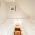Das Schlafzimmer mit zwei Einzelbetten eignet sich auch sehr gut für Kinder