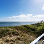 View of the sea from a terrace with railing