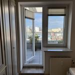 Room with balcony and city view