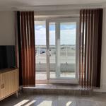 Room with TV and terrace door for view