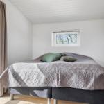 Bedroom with bed, window, and ceiling