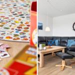 Living room with black leather sofa and wooden table. Toys are on the floor.