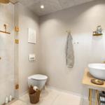 Bathroom with shower, toilet, and sink. Gold fixtures and wall-mounted holder.