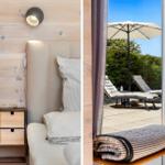Bedroom with wooden wall and nightstand. Terrace with loungers and umbrella.