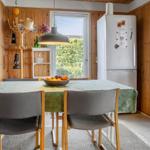 Dining area with table, chairs, and view of garden