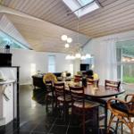 Kitchen with dining area and large window view of the garden