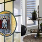 Stained glass window with coat of arms and two-tiered serving tray with succulents.