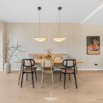Dining area with table, chairs, and window for views.