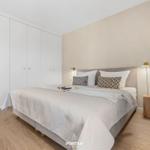 Bedroom with bed, wardrobe, and nightstand