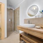 Bath with shower, sink, and sauna