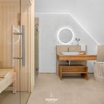 Bathroom with sauna, sink and shower