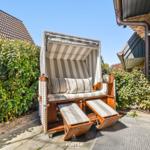 High-quality beach chair with seat and feet on paved courtyard