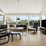 Living room with seating, TV, and large window view