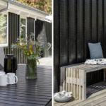 Terrace with table, chairs, flowers, and coffee mugs. Wooden bench with cushion and blanket against black wall.