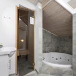 Bathroom with whirlpool, shower, and sink
