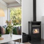 Living room with sofa, table, and flowers. Fireplace with burning wood.