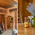 Holzhaus mit Kamin und Obergeschoss. Tisch mit Vase und Glasbehälter.