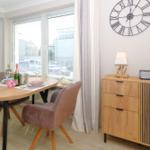 Dining room with table, chairs, and view of the street