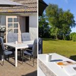 Outdoor area with table, chairs, and umbrella in front of a house with garden.