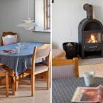 Dining room with wooden table and chairs. Fireplace with burning wood.