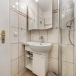 Bathroom with shower, sink, and mirror cabinet