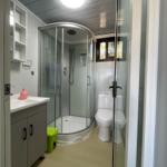 Bathroom with shower, toilet, and sink