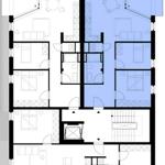 Floor plan showing layout with multiple rooms and staircases.