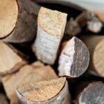 A basket with chopped firewood pieces.