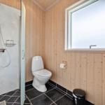 Bathroom with shower, toilet, and window
