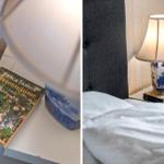 Schlafzimmer mit Nachttisch, Lampe und Buch auf dem Tisch.