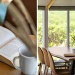 Ein Tisch mit Stühlen und einem Fensterblick auf Grün. Ein Buch und eine Tasse auf einem Holztisch.
