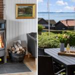 Innenraum mit Kamin und Holzstapel. Außenbereich mit Tisch, Blumen und Meerblick.