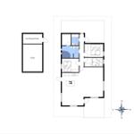 Funktionaler Grundriss mit Küche, Schlafzimmer und Bad. Anbau mit Garage und Schuppen.