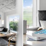Wohnzimmer mit Sofa, Tisch und Blick auf grüne Landschaft. Nebenraum mit Schreibtisch und Spielbox.