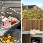 Terrasse mit Tisch, Stühlen und Teezubehör. Hintergrund: Holzgeländer und grüne Pflanzen.