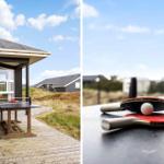 Tischtennisplatte auf Terrasse mit Blick auf das Haus und Grasland.