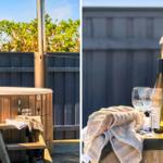 Hochwertiger Whirlpool mit Weinkrug und Handtuch auf Terrasse.