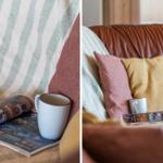 Ein braunes Ledersofa mit Kissen und einer Tasse. Eine Zeitschrift liegt daneben.