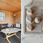 Wohnzimmer mit Holzwand und Sofa. Keramikobjekte auf Marmorplatte.
