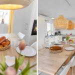 Esszimmer mit Holztisch, Stühlen und Korb mit Brot. Küche mit weißen Schränken und hängenden Lampen.