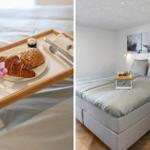 Frühstückstablette mit Brötchen und Blumen auf Bett. Schlafzimmer mit Wandbildern von Seehunden.