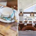 Esszimmer mit Holztisch, braunen Stühlen und großen Fenstern. Tisch gedeckt mit Schüssel und Glas.