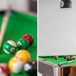 Pool table with colored balls and cue on green felt.