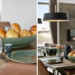 Dining table for multiple people, ceramic bowl with bread rolls, modern pendant light.