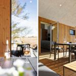 Terrasse mit Tisch, Stühlen und Wein. Holzwand und Blick auf Außengelände.